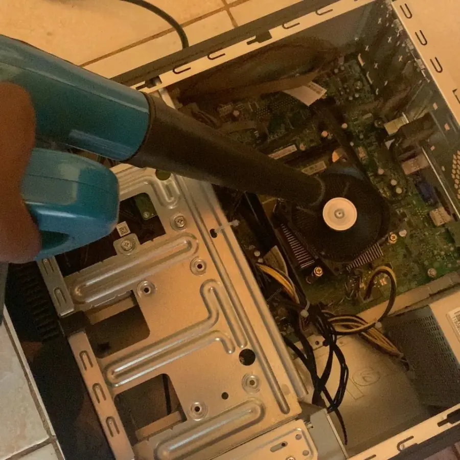 Regisam Technologies engineer working on computer hardware